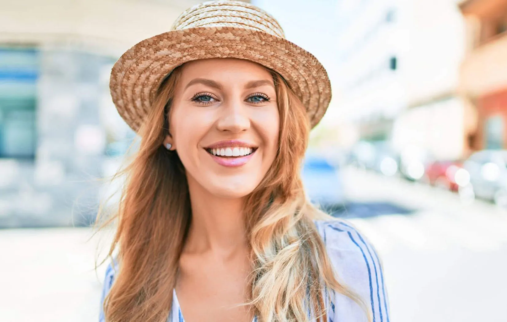 Girl smiles with confident after teeth whitening