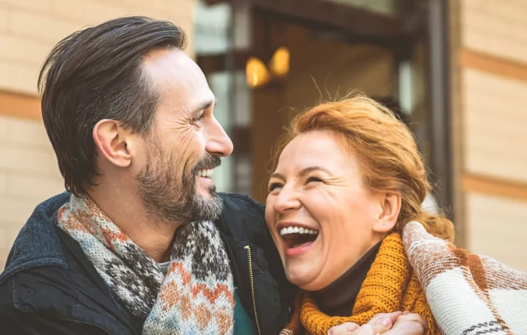 Patients smiling after All-on-4 life changing procedure