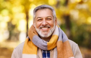 Happy patient after saving his tooth with root canal treatment