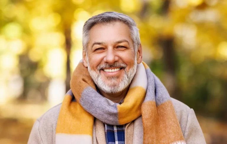 Happy patient after saving his tooth with root canal treatment